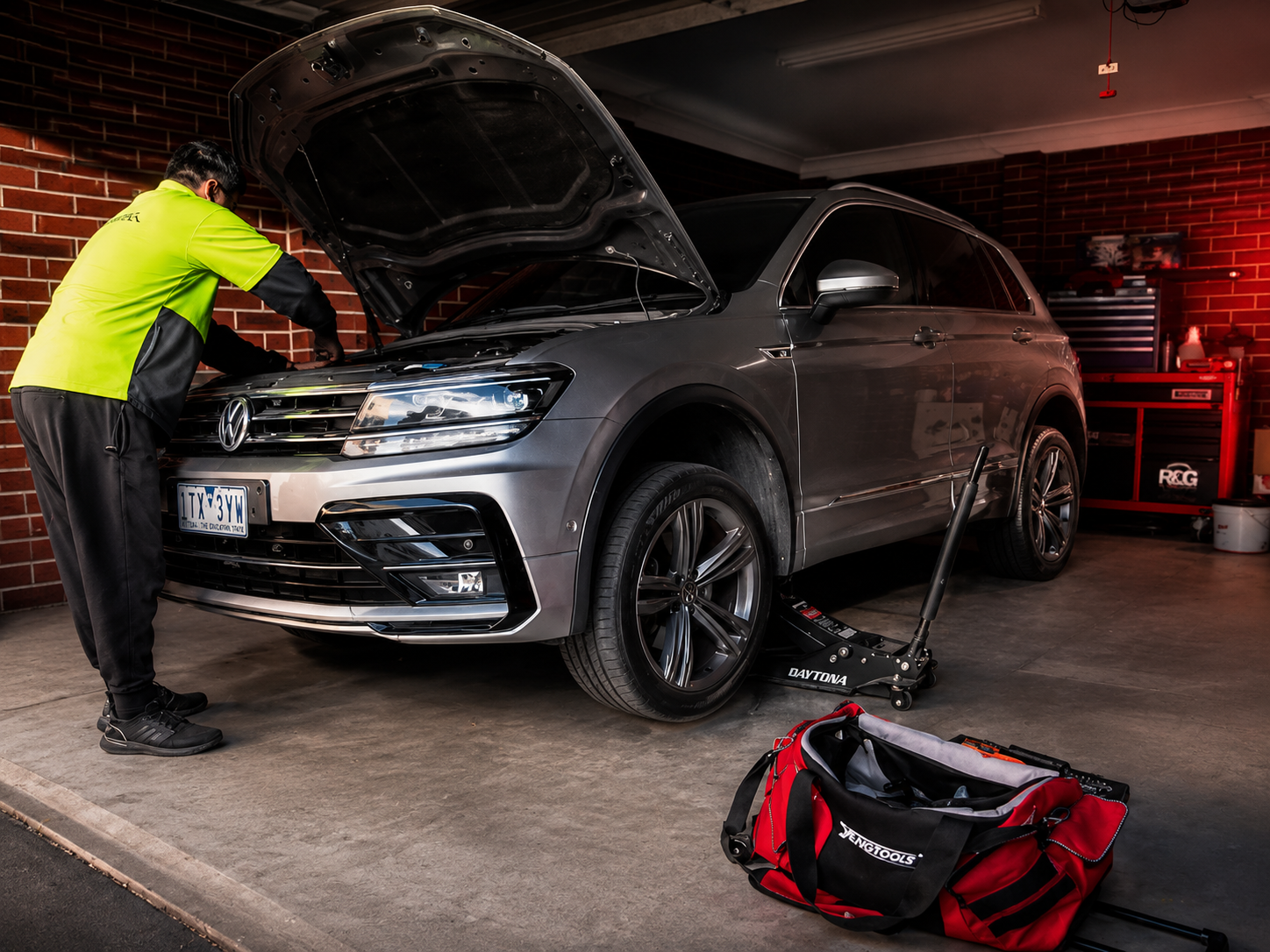 Art-directed placeholder of a local mobile mechanic beside an everyday vehicle